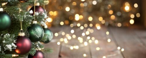 Christmas Tree, Red and Green Ornaments against a Defocused Lights Background