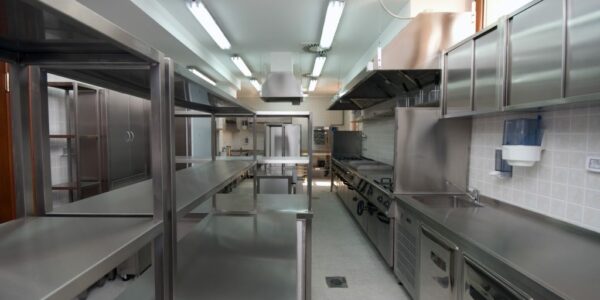 Industrial hotel kitchen with steel shelving