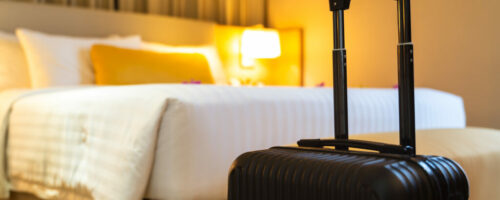 Suitcase delivered standing in hotel room. concept of Hotel service and travel