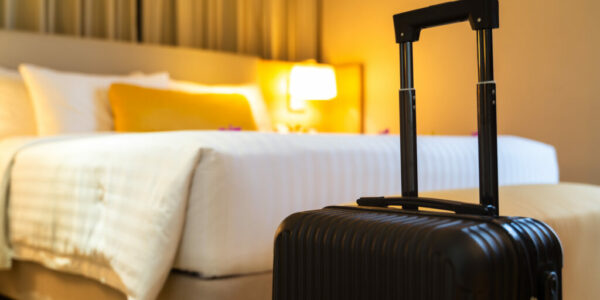 Suitcase delivered standing in hotel room. concept of Hotel service and travel