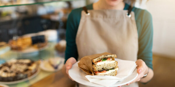 Waitress ready to serve food in cafe