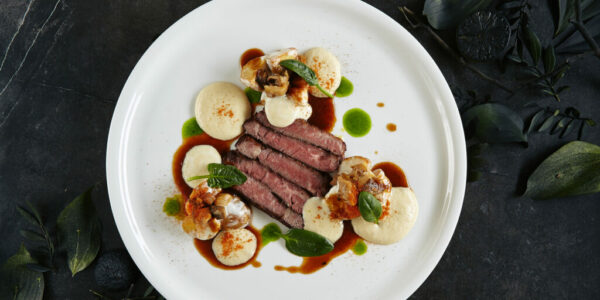 Restaurant Plate of Black Angus Beef Fillet with Warm Potatoes in Cheese Sauce and Mushroom Espuma