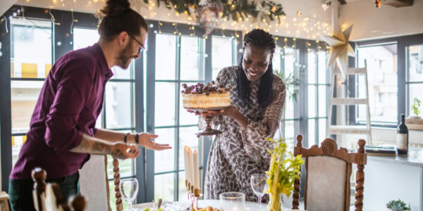 Happy couple getting ready for Christmas dinner