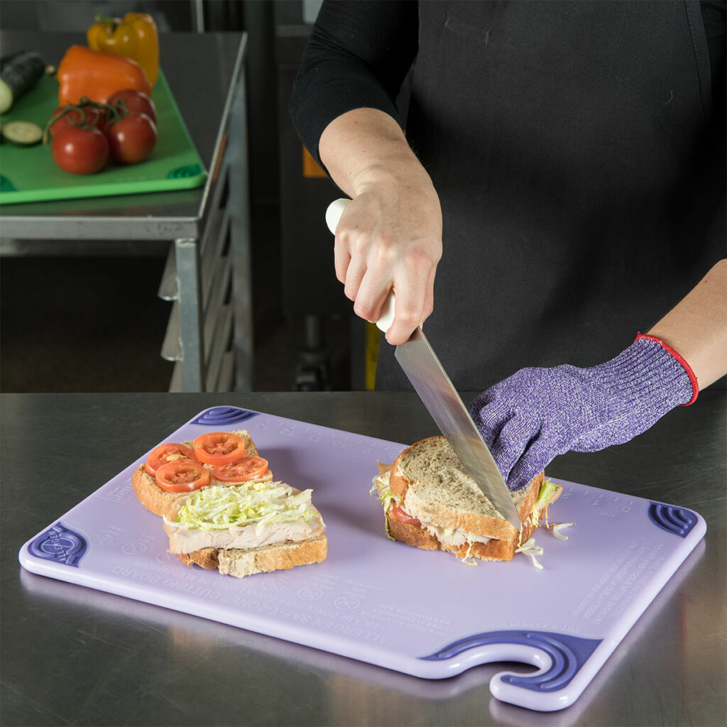 Chef using Allergen Free Chopping Board in kitchen