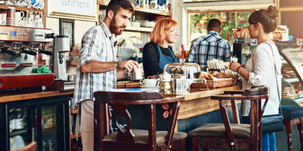 Barista, woman and cafe as waitress in small business with customer in restaurant or coffee shop. Working people, cafeteria and client for food service with entrepreneur in startup Barista, woman and cafe as waitress in small business with customer in restaurant or coffee shop. Working people, cafeteria and client for food service with entrepreneur in startup